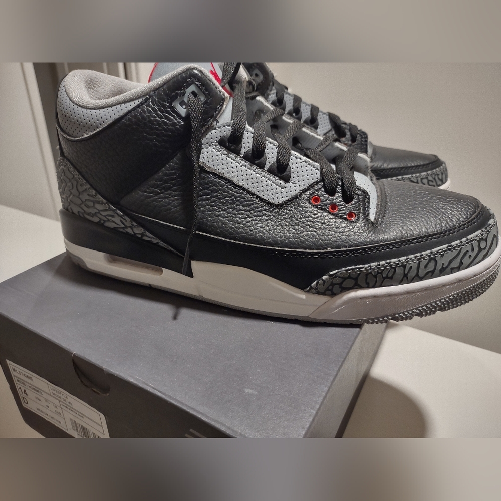 Jordan Black and Gray Sneakers with Retro Style and Visible Air Cushion